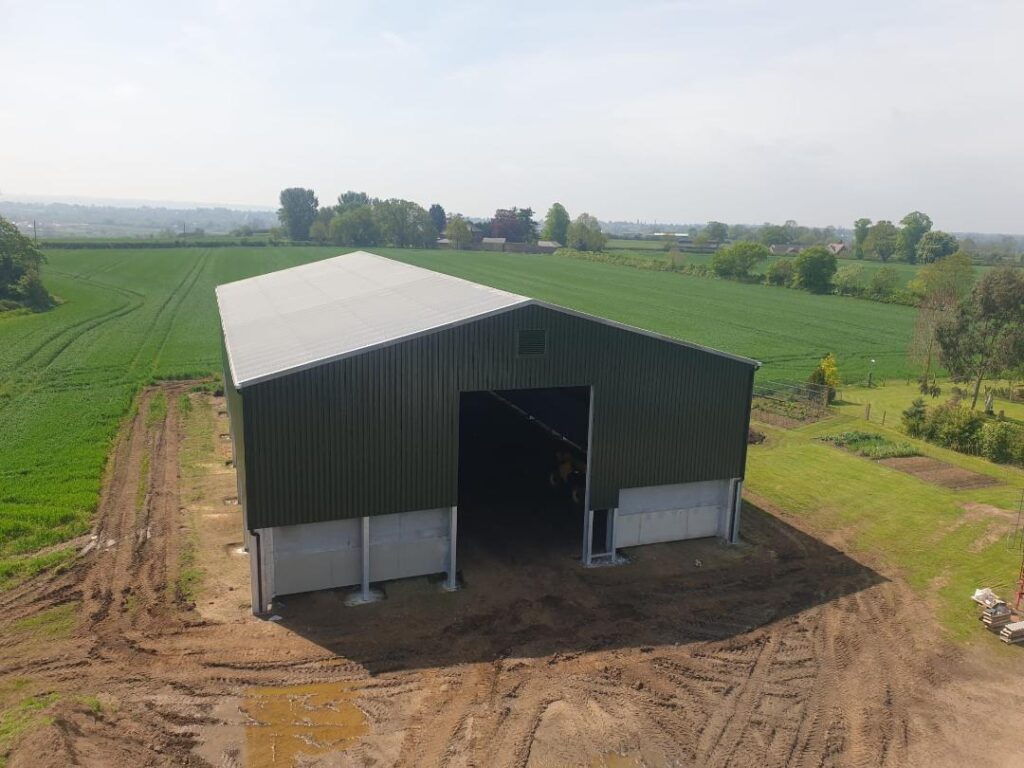 Aerial view of Steel framed storage building with juniper green steel box cladding and concrete panels.
